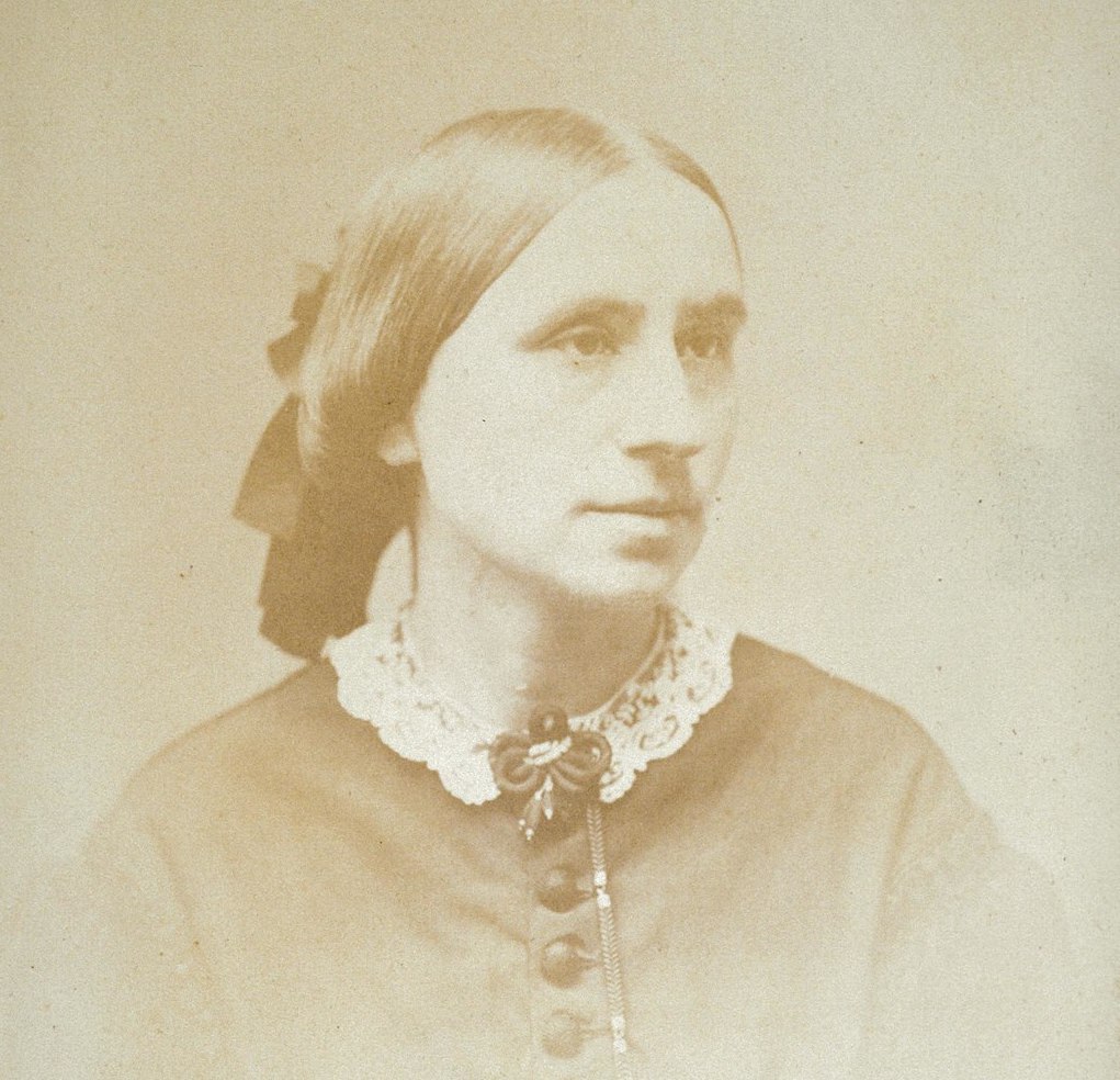 A 19th century photograph of the doctor wearing a dress with a lace collar.