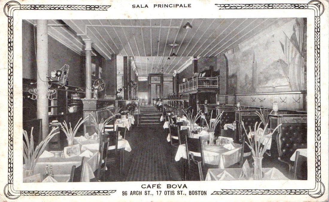 Large Restaurant With Tablecloths And Centerpieces, Leather Booths, And Murals With Italian Scenes On The Wall.